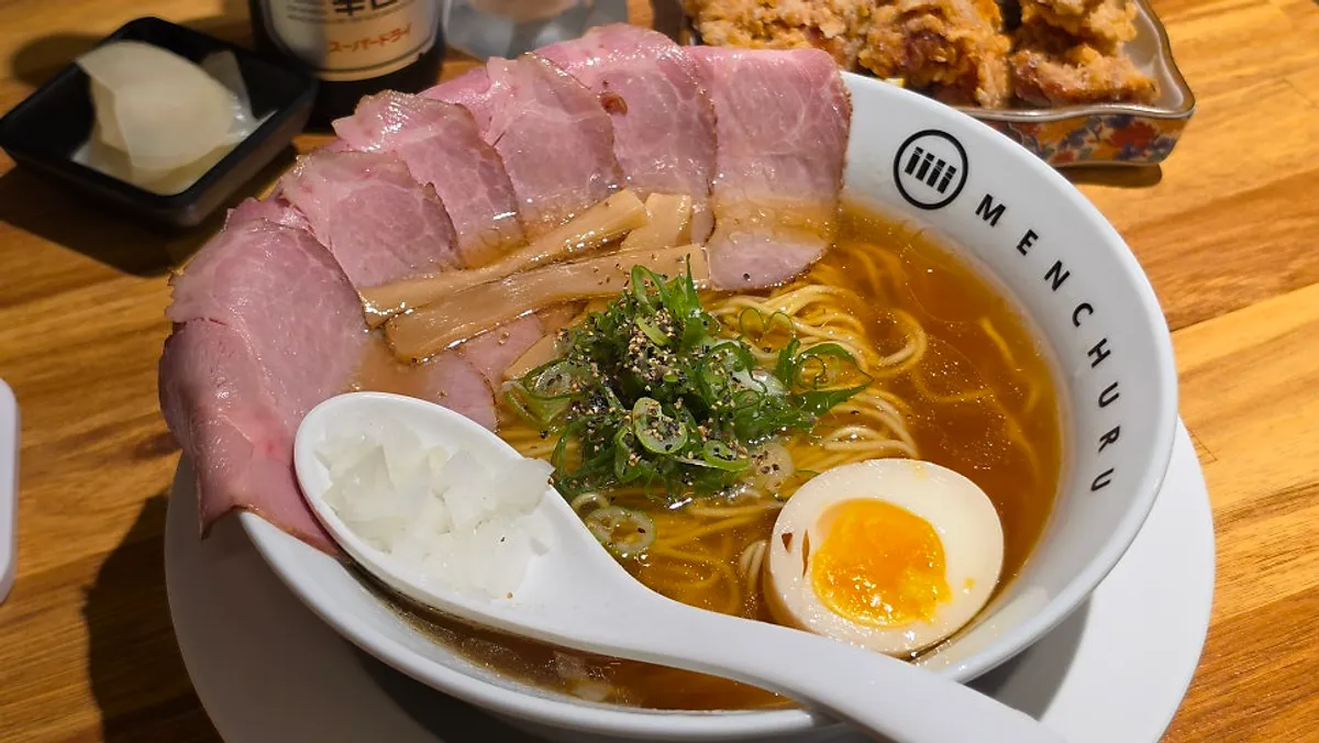 Shoyu ramen and side dish spread at Mentsuru Euljiro Branch