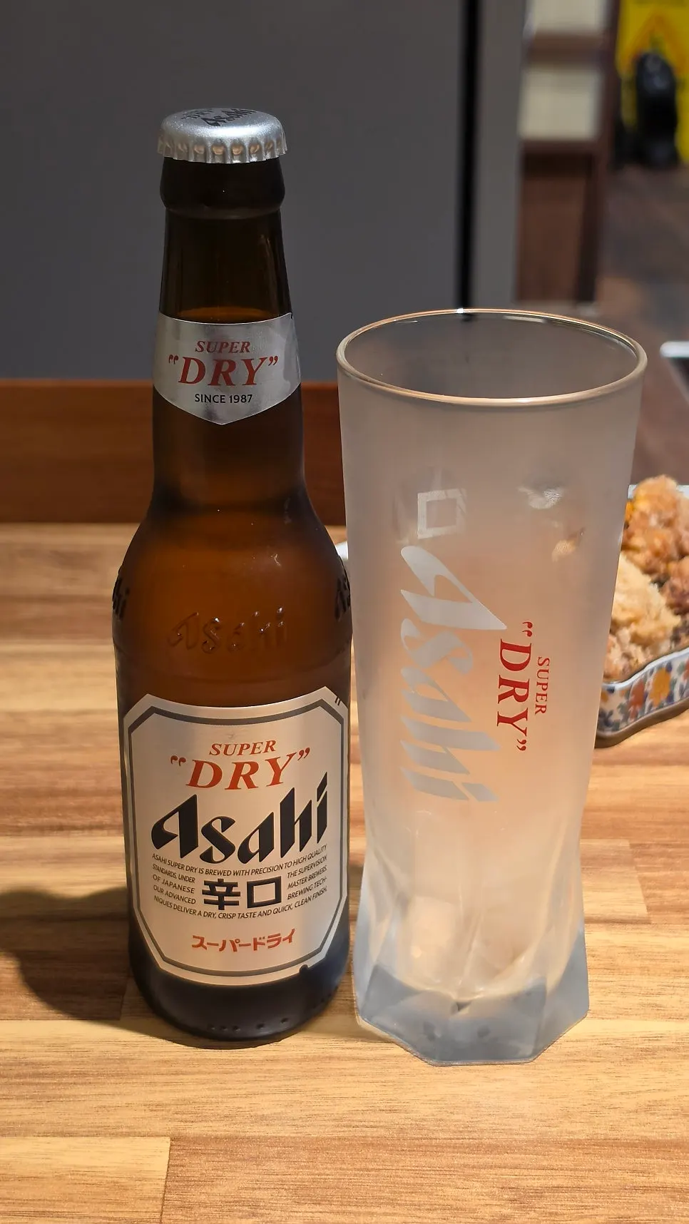 A glass of draft beer paired with karaage