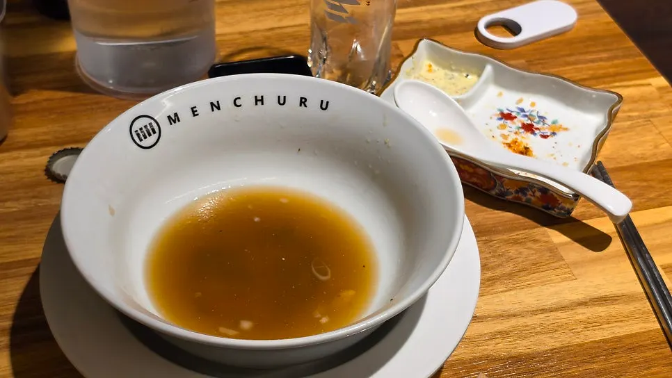 Table set with shoyu ramen, karaage, and beer together