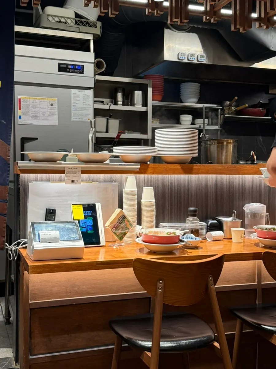 Bar table seating facing the kitchen