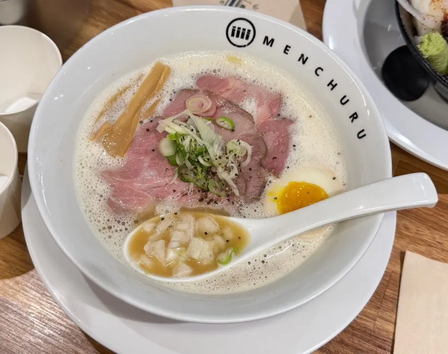 Noodles lifted up from the tori paitan bowl