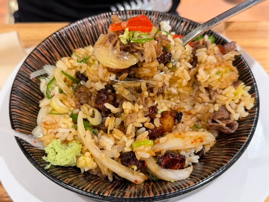 A piece of daechang from the hormone-don topped with wasabi