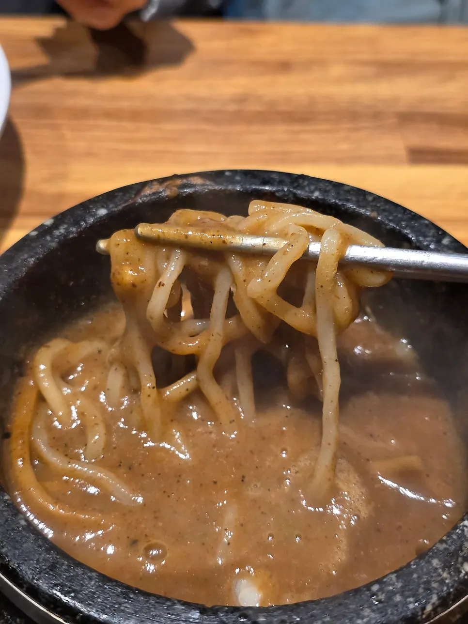 Thick tsukejiru dipping sauce served in a stone pot