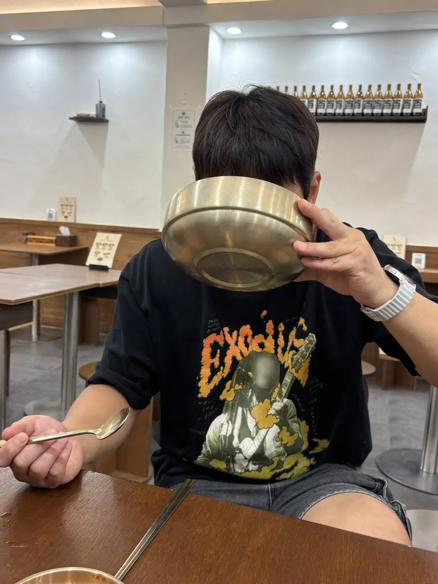 A nearly finished brass bowl of pork gomtang