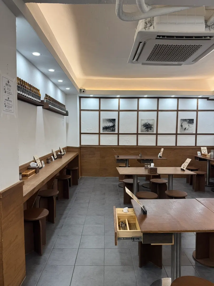 Interior of Baekok Myeongdong with wood-toned minimal decor