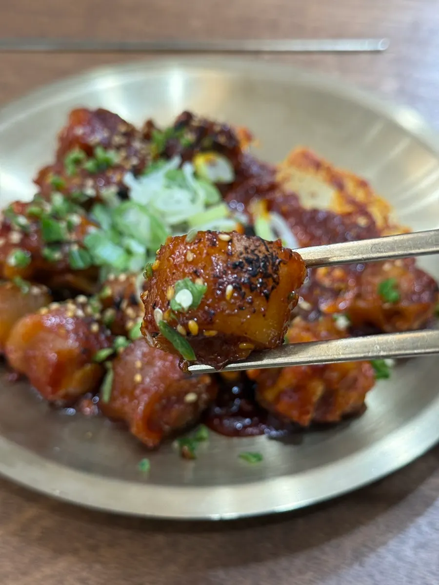 Collagen-rich pork tail pieces with spicy sauce