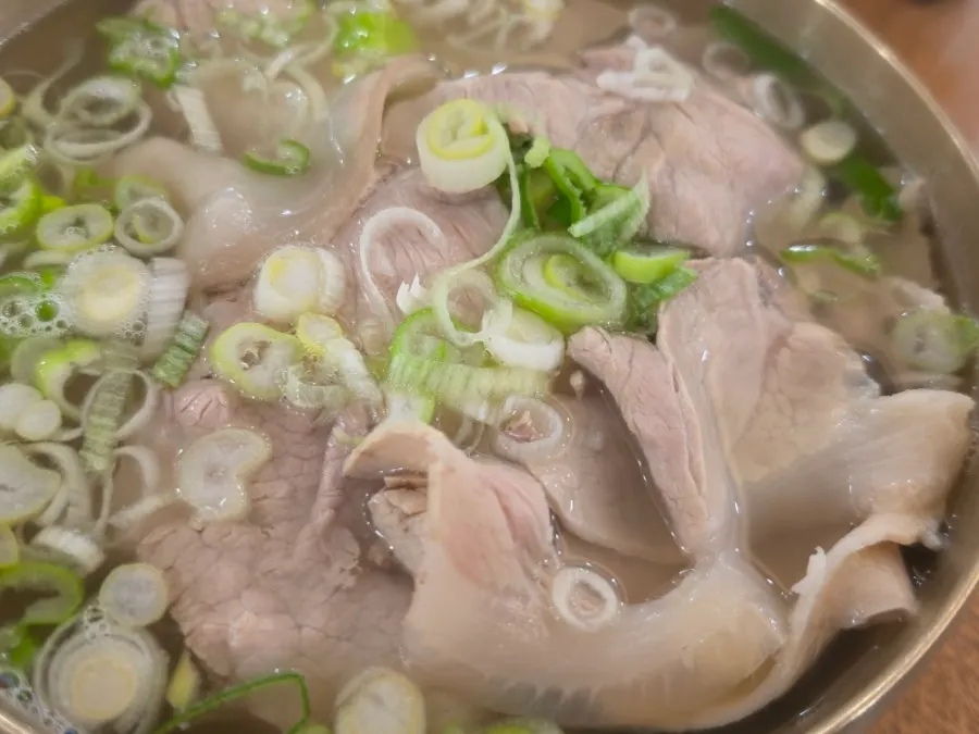Pork shoulder piled generously on top of the broth