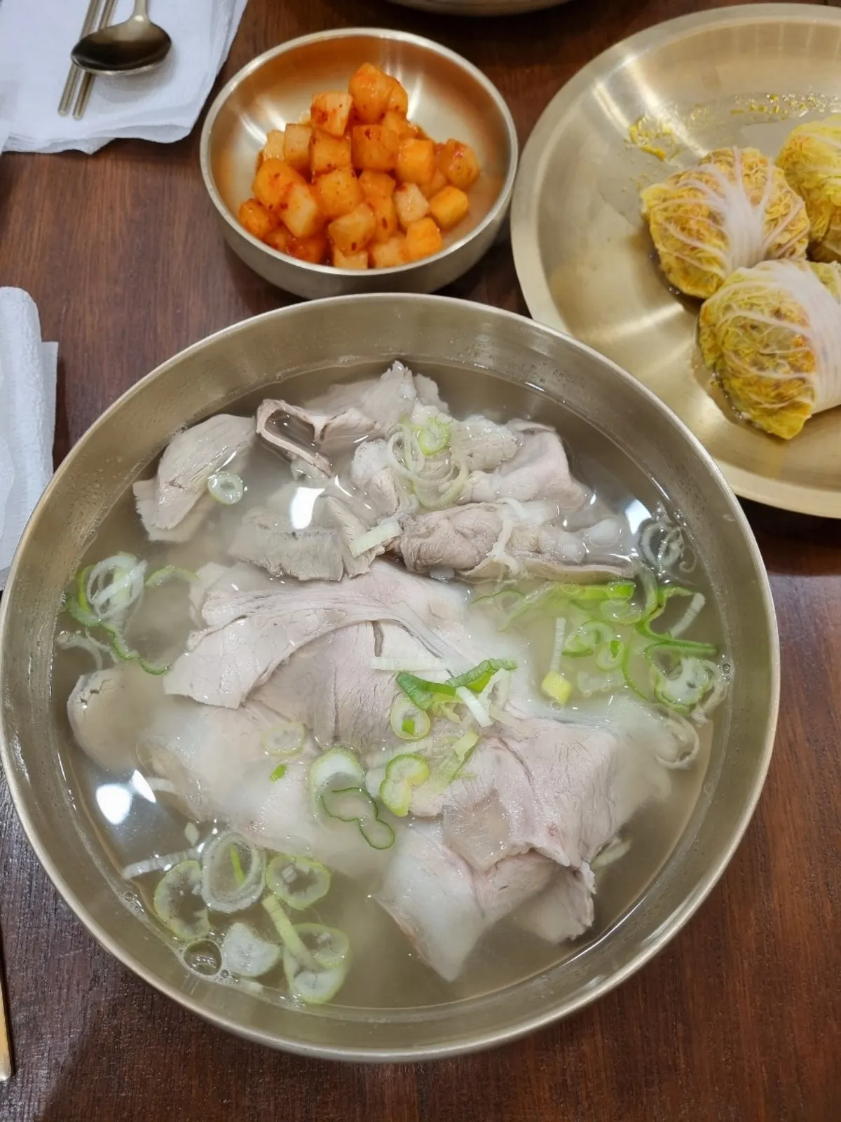 Pork gomtang from Baekok Myeongdong served in a brass bowl set