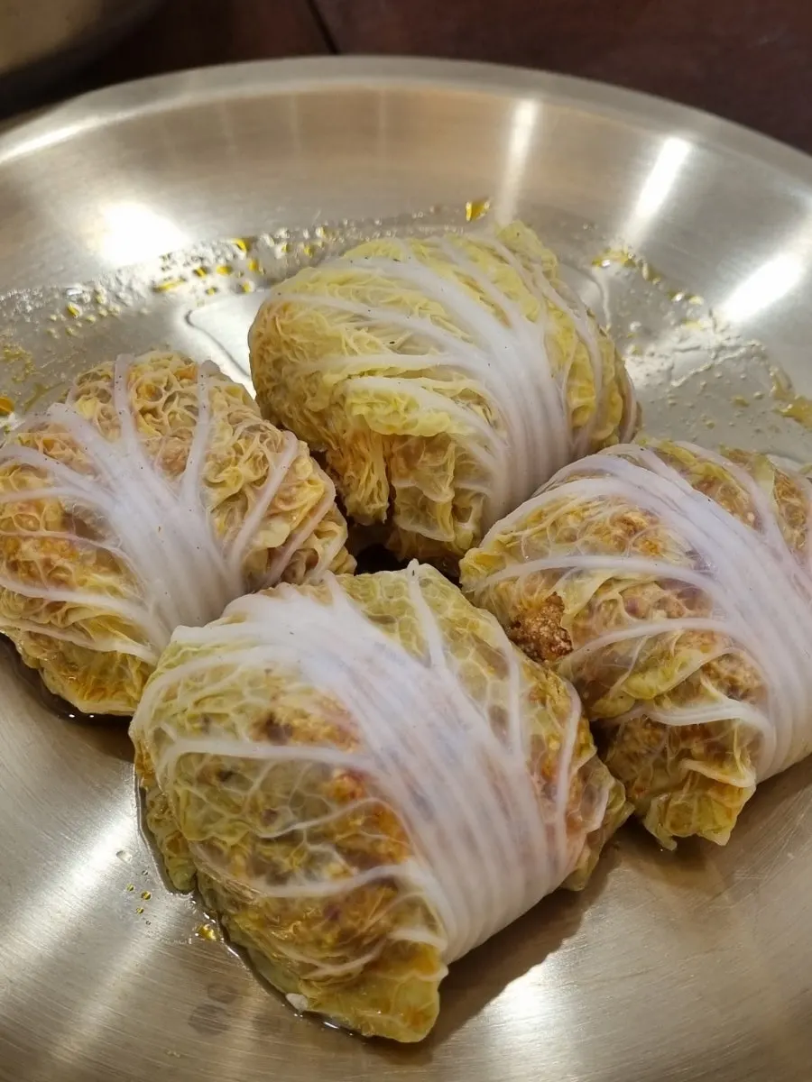 A plate of cabbage dumplings ordered as a side at Baekok Myeongdong