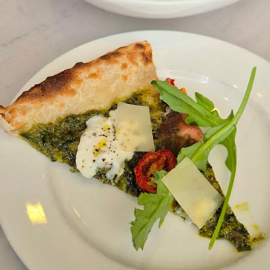 Basil pizza topped with burrata and prosciutto