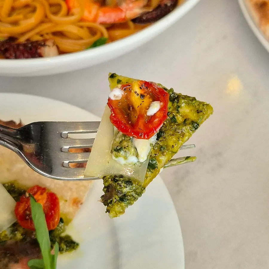 Basil pesto and sun-dried tomato pizza