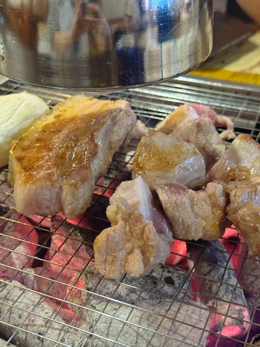 Omija-aged black pork cooking to a golden brown