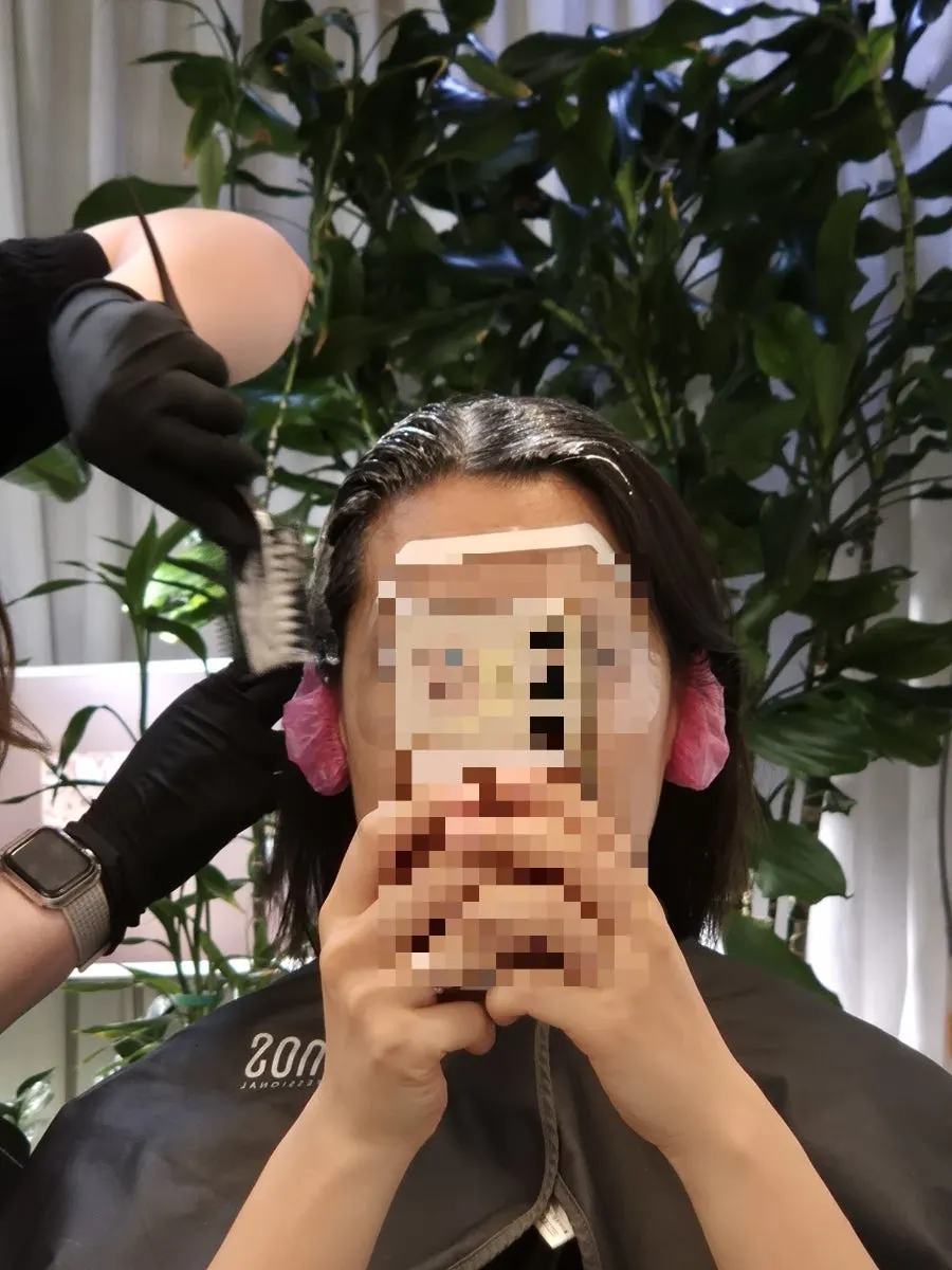 Applying dye all over the hair