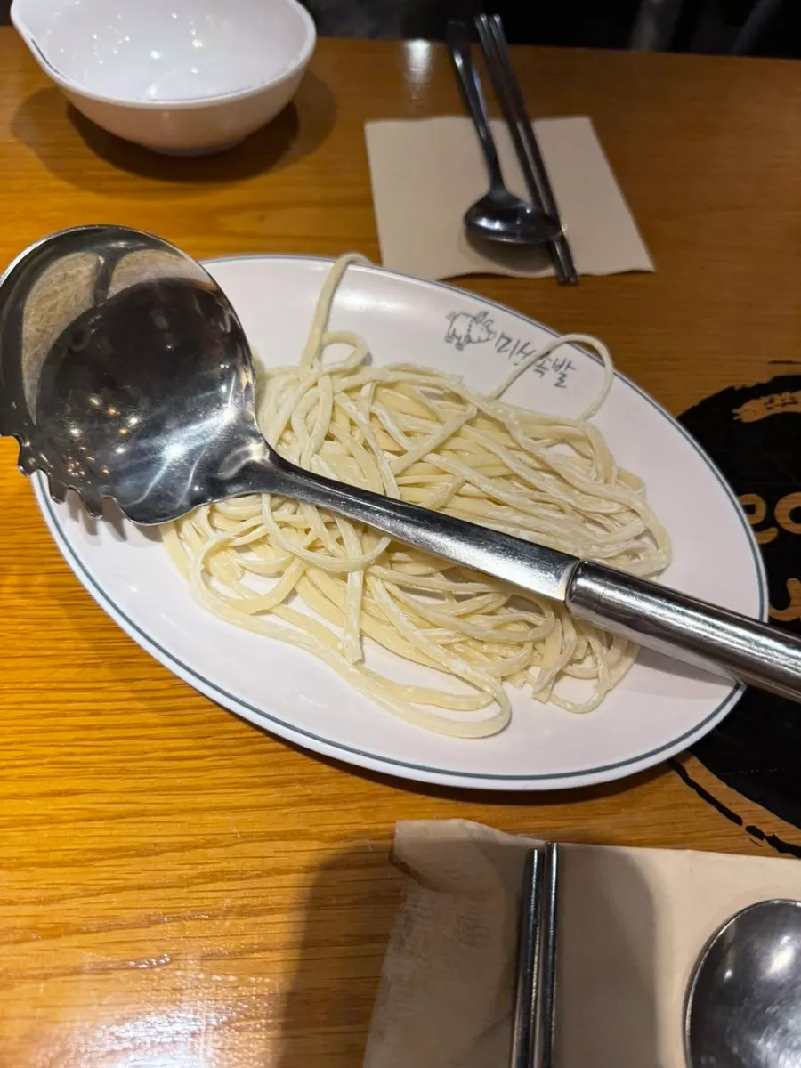 Complimentary spicy kalguksu photo