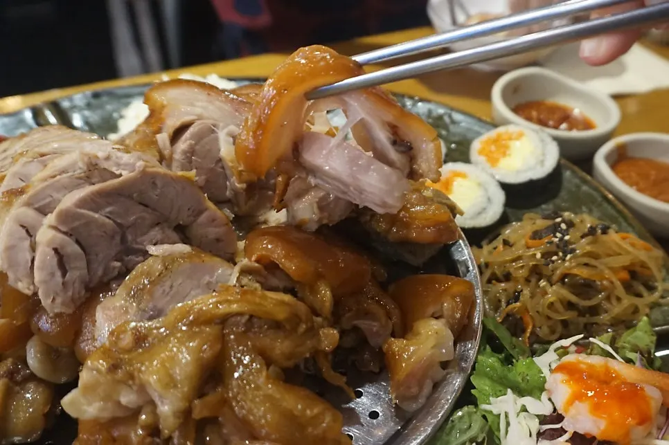 Jokbal spread with colorful accompaniments