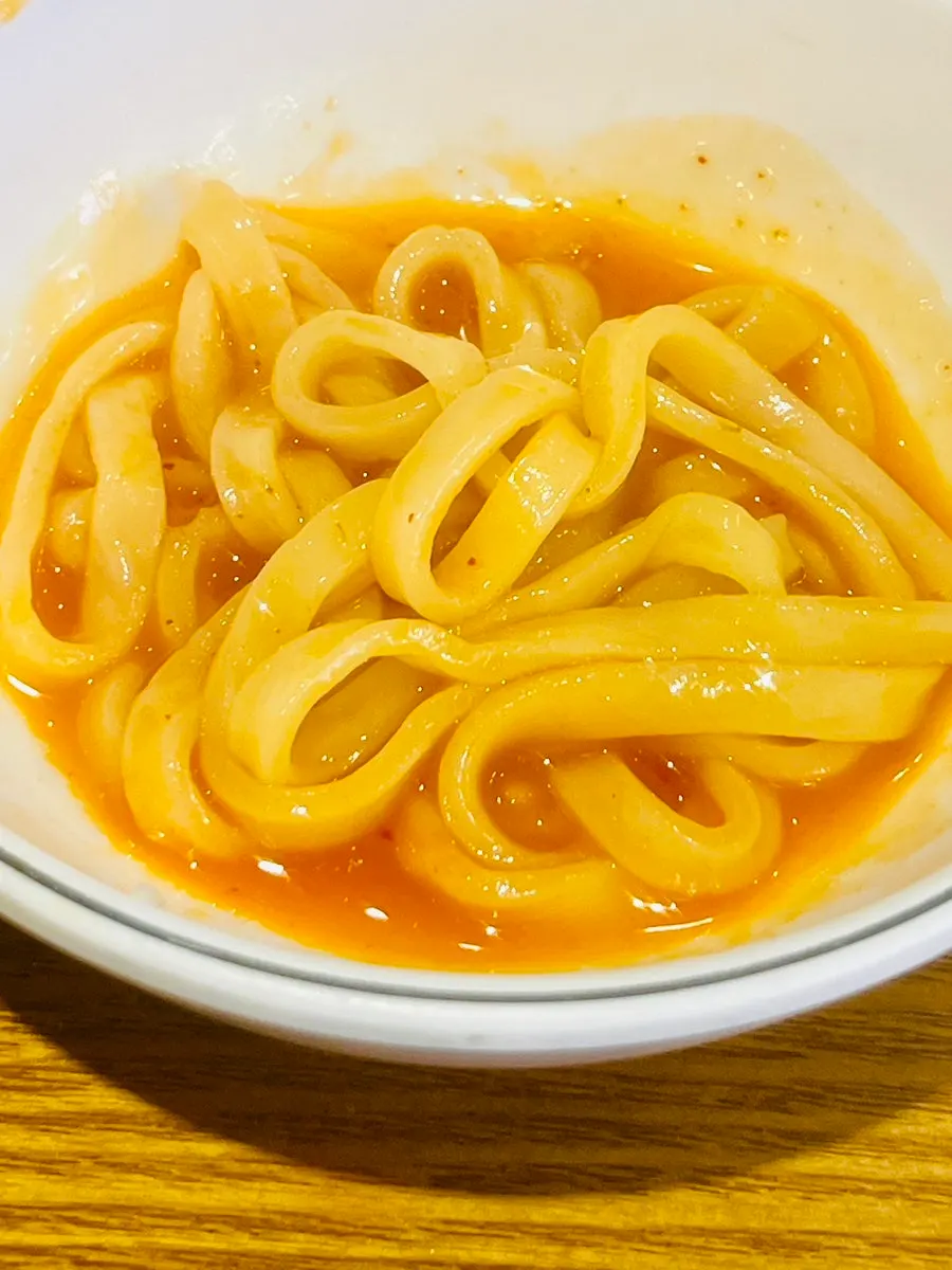 Kimchi kalguksu portioned into a bowl