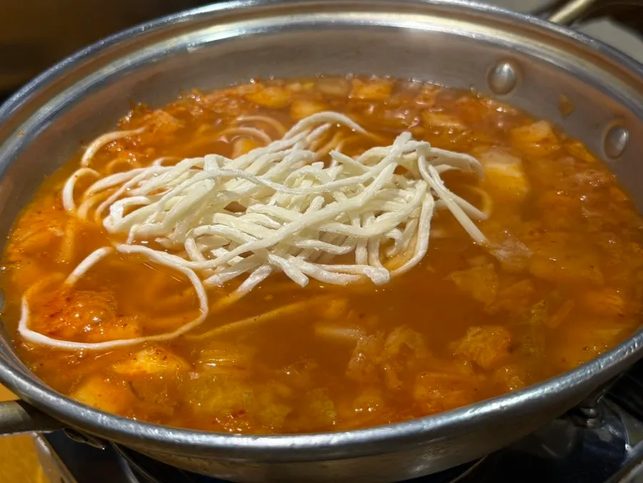 Broth and noodles of the kimchi kalguksu