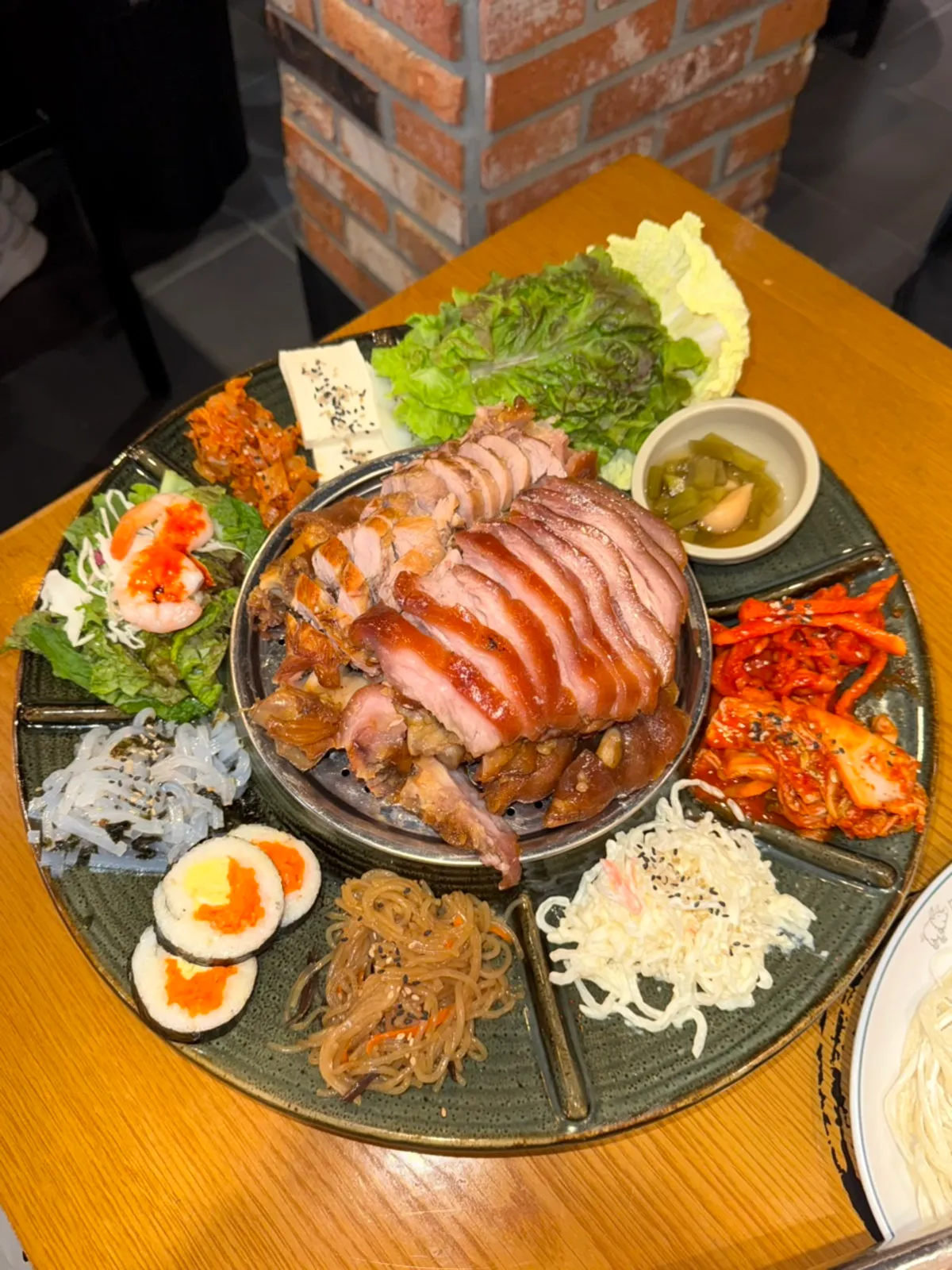 Emperor Jokbal table spread with all the sides