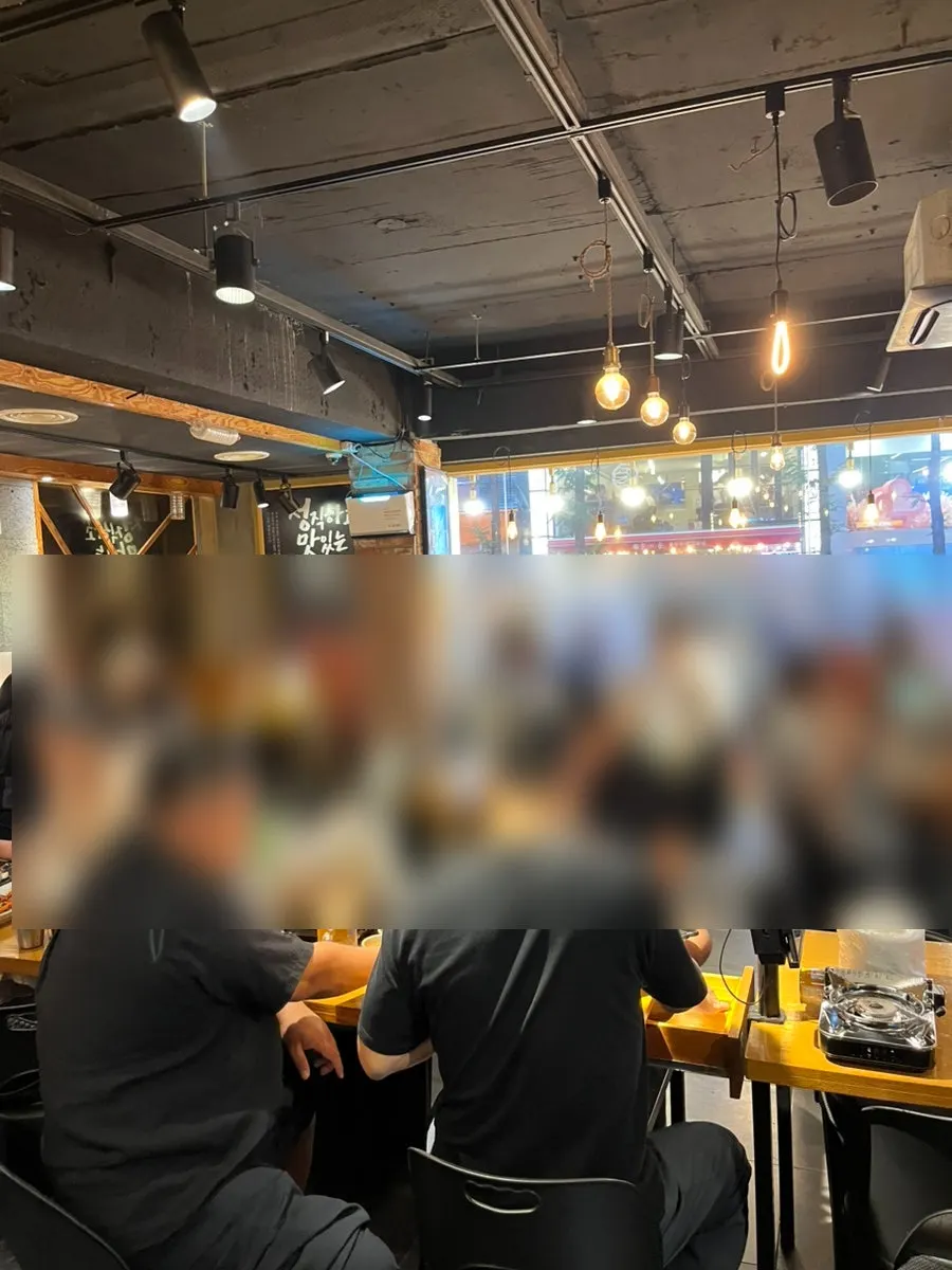 Interior of the restaurant with wide 4- to 6-person tables
