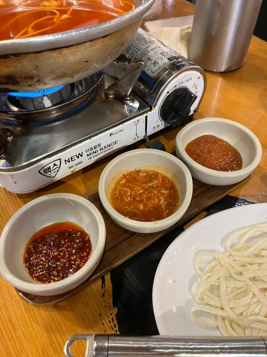 Pot of kimchi kalguksu before boiling