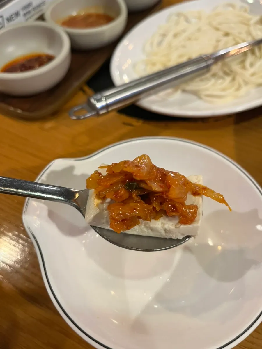 Dubu kimchi topped with stir-fried kimchi