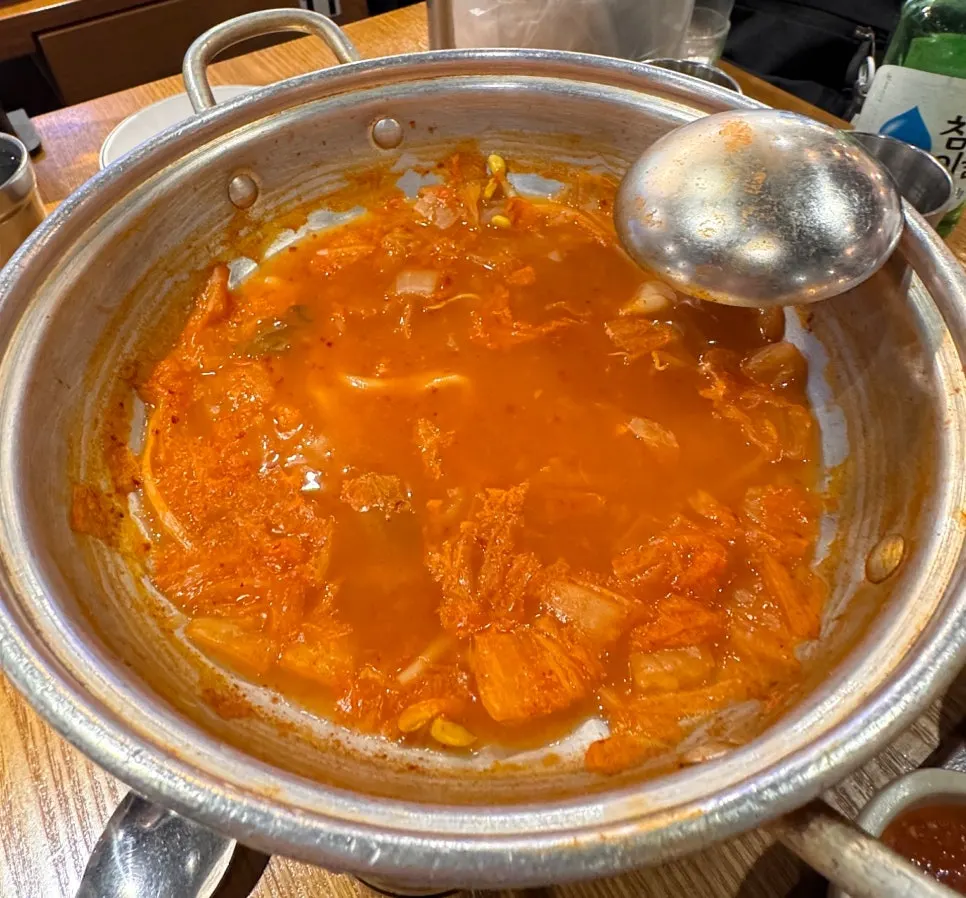 Kimchi kalguksu broth boiled for the finish