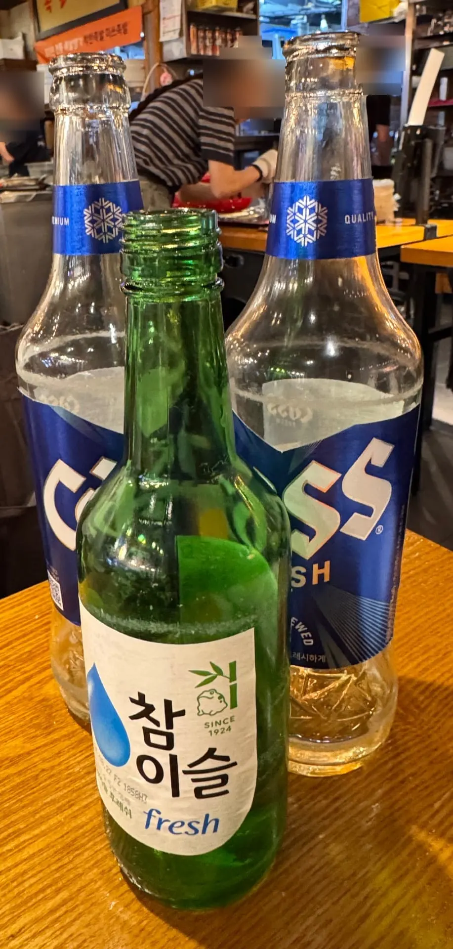 Beer and soju set out on the table for the evening gathering