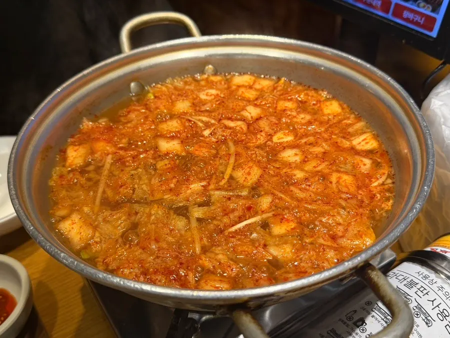 Pot of kimchi kalguksu served first