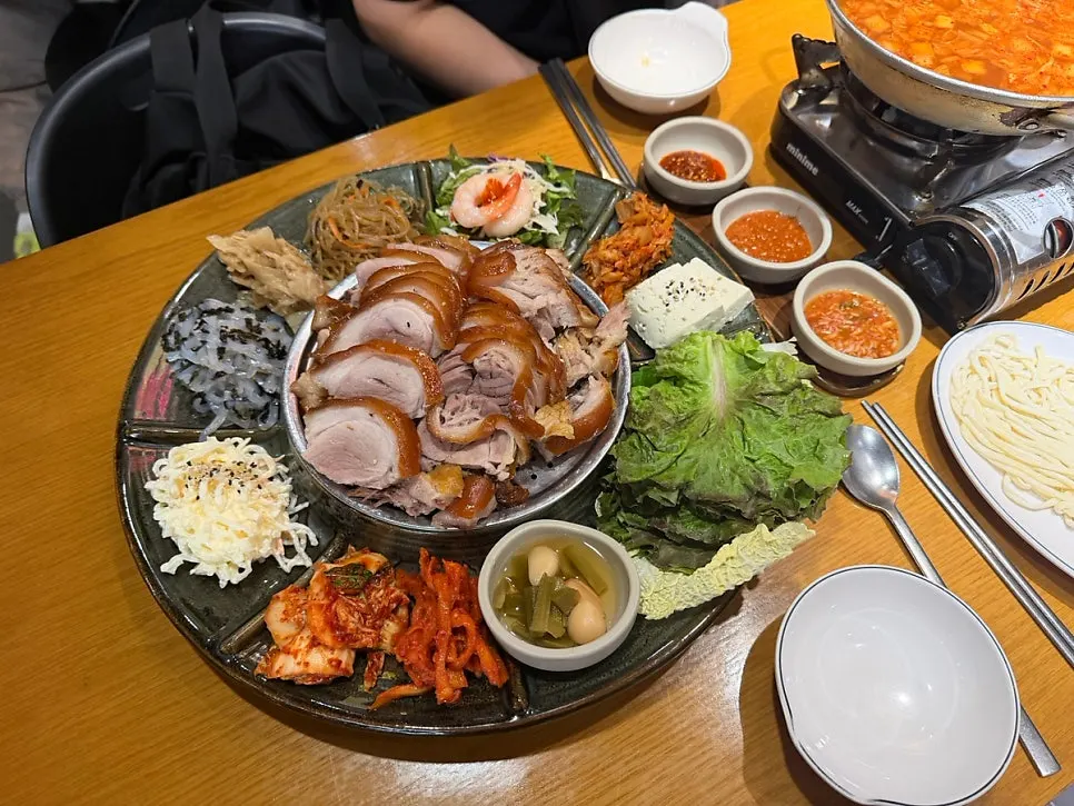 Kalguksu broth with finely chopped kimchi