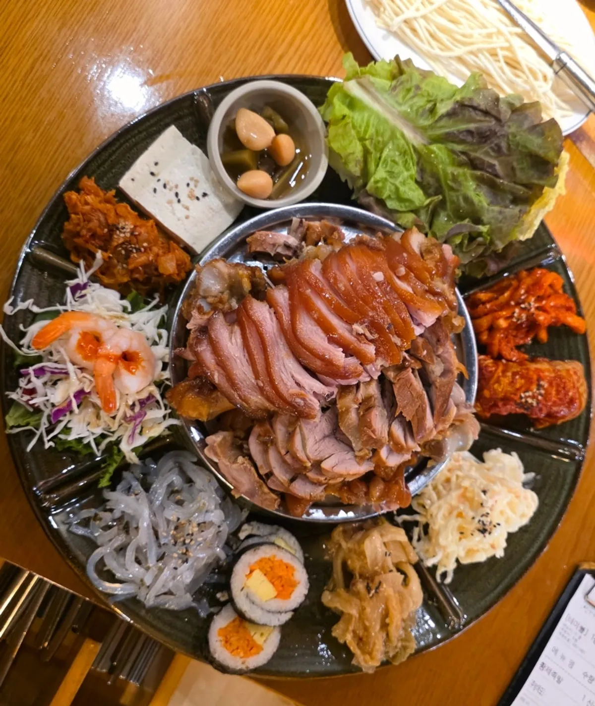 Pot of kimchi kalguksu served first
