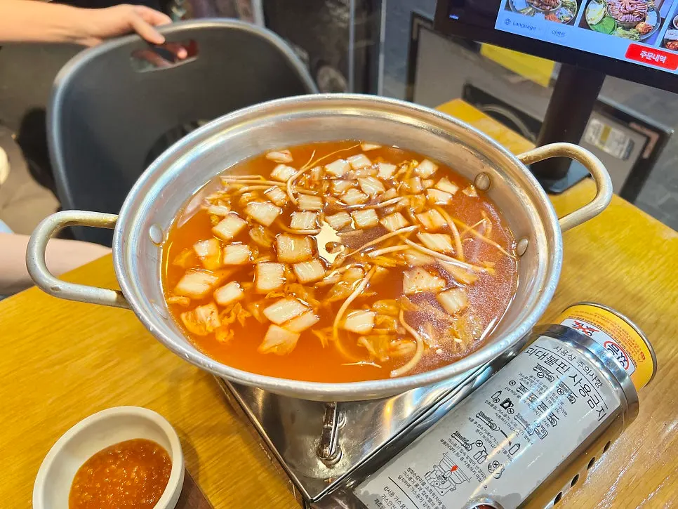 Kimchi kalguksu broth bubbling away