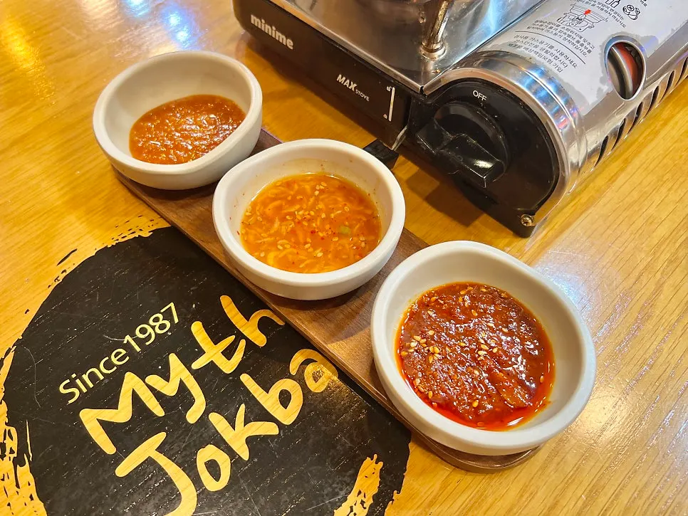 Three sauces: ssamjang, salted shrimp, and mala sauce