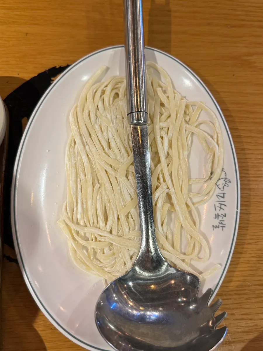Complimentary kimchi kalguksu setting