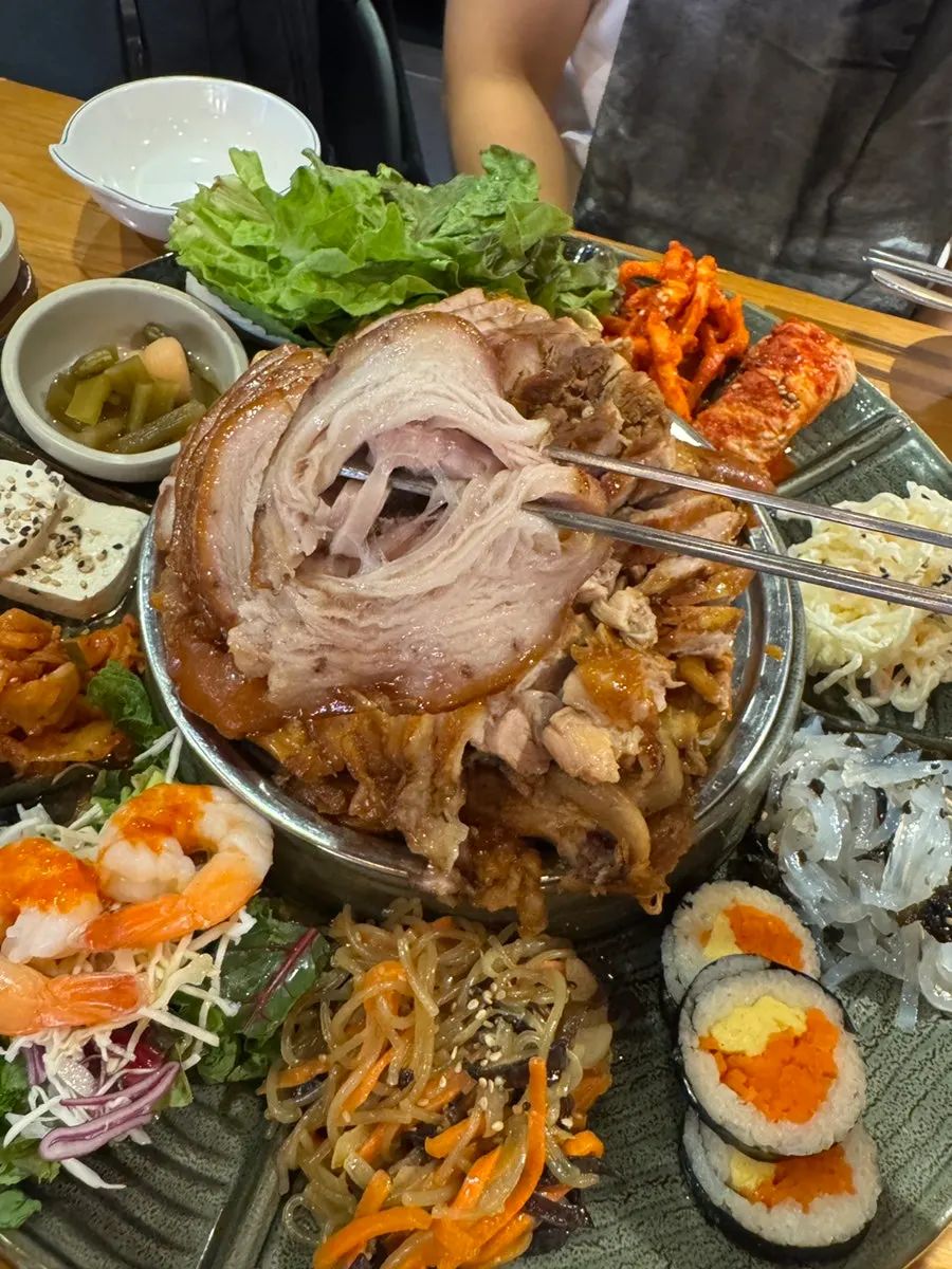 Jokbal meal with kimchi and japchae