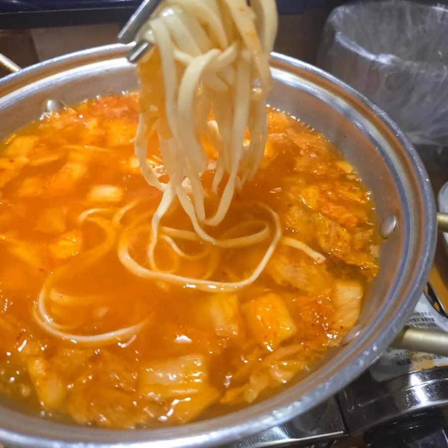 Generous portion of complimentary kimchi kalguksu