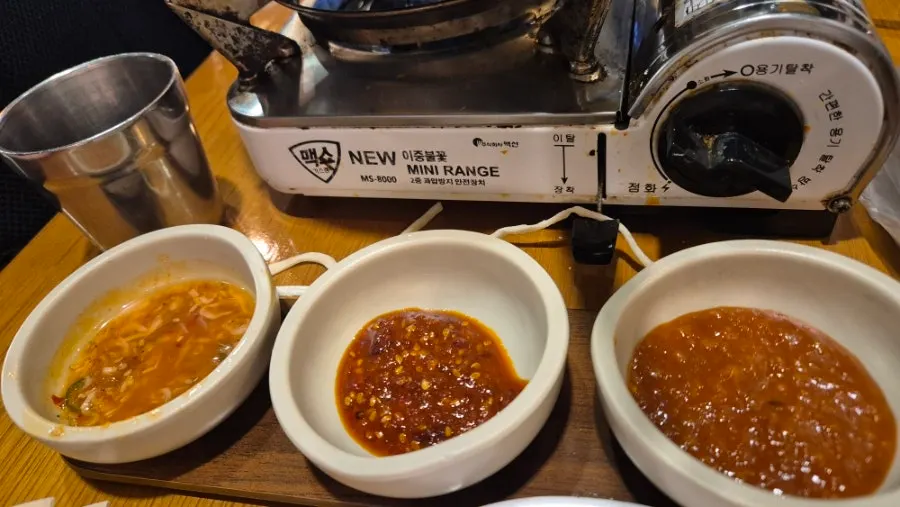 Three sauces: ssamjang, salted shrimp, and mala sauce