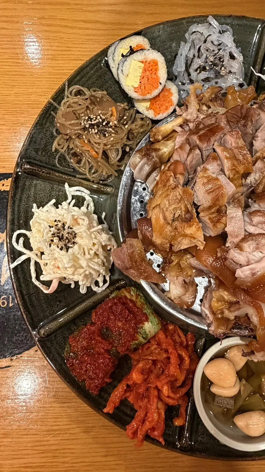 An assortment of side dishes served alongside the jokbal
