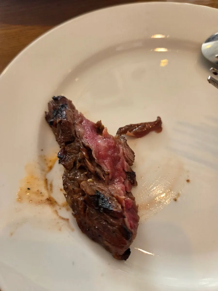 Close-up of steak served with carrot hummus