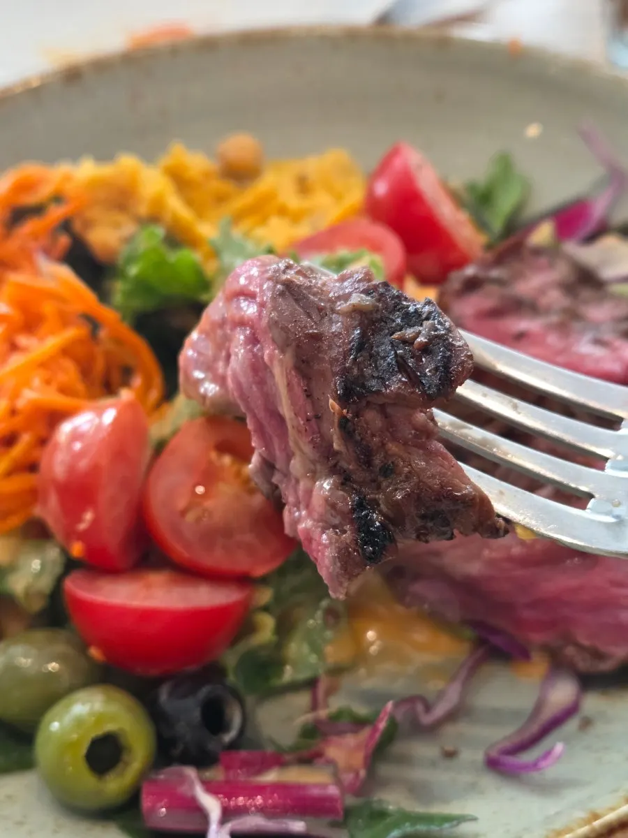 Steak eaten together with vegetables