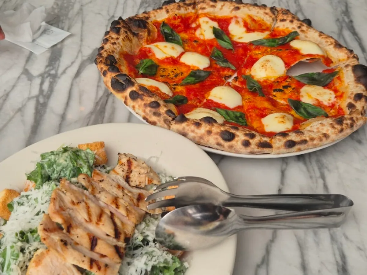Thin-crust Margherita pizza