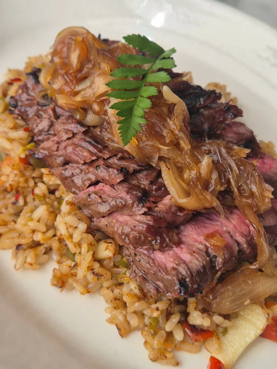 Spicy rice topped with cut steak