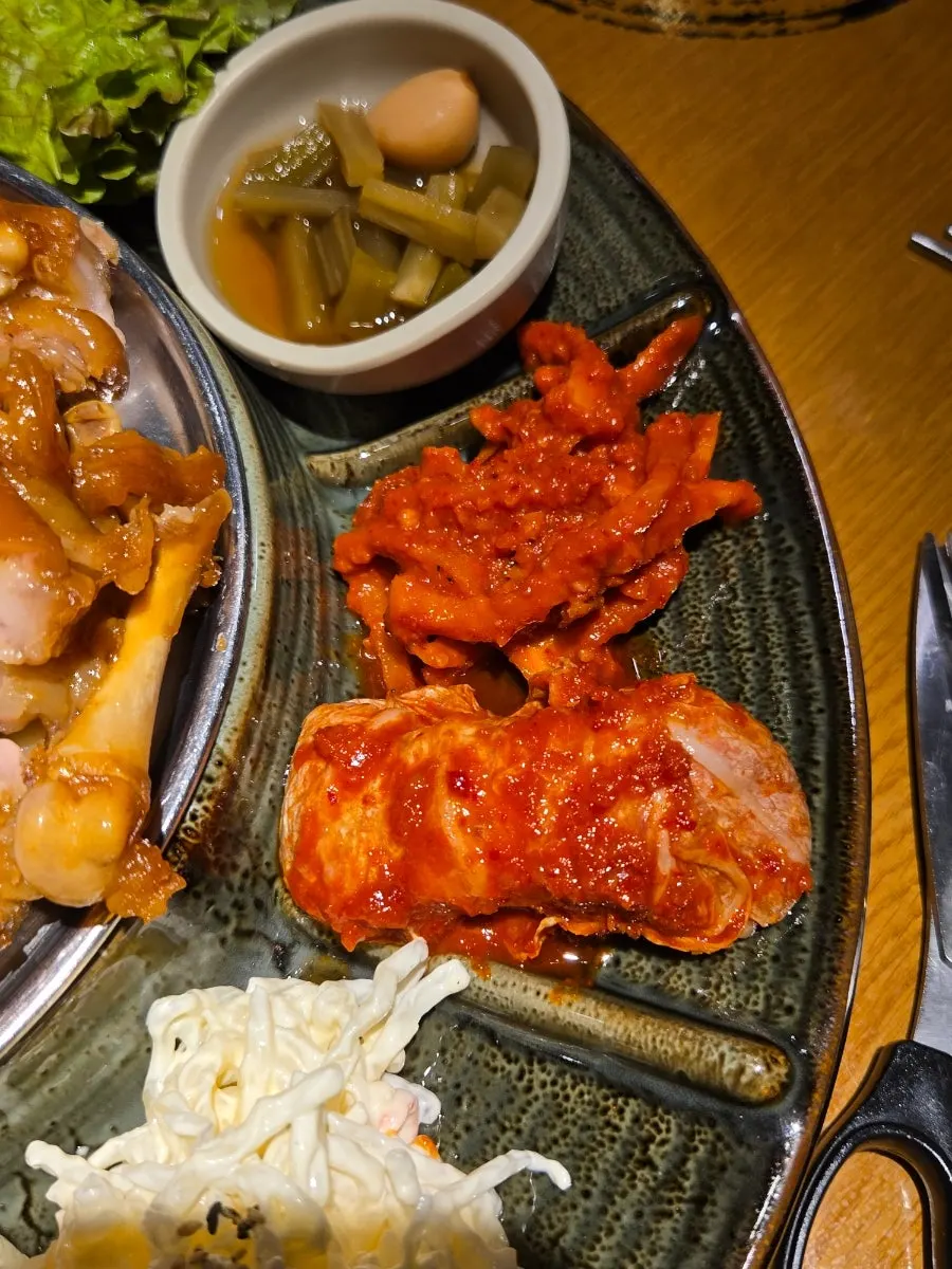 Dubu kimchi, aged kimchi, and cheongpomuk muchim side dishes