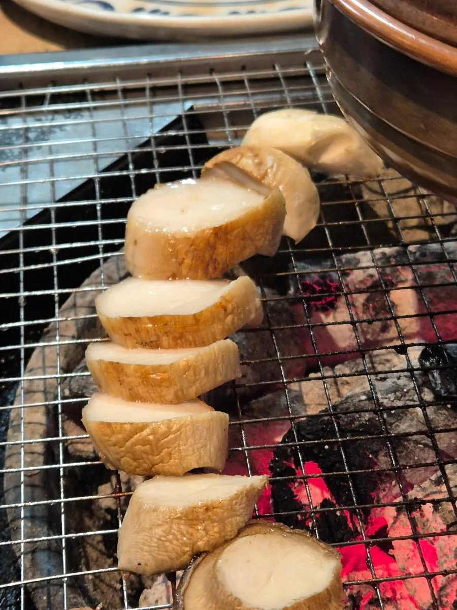 Pork belly served with pickled perilla leaves