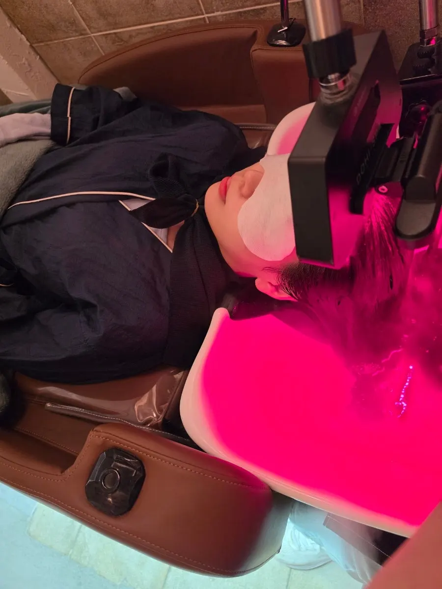 Head spa being performed while lying down