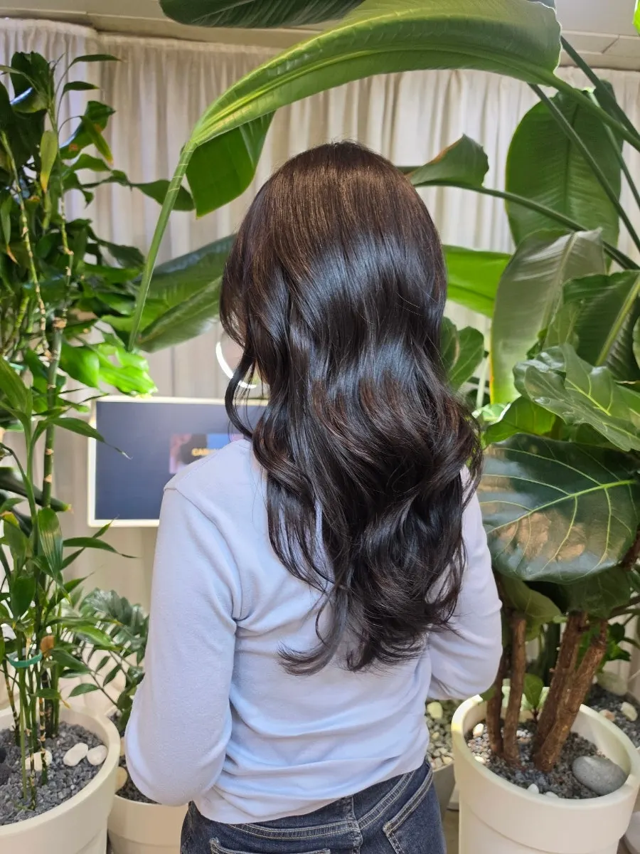 Long hair with bouncy curls after the clinic and styling