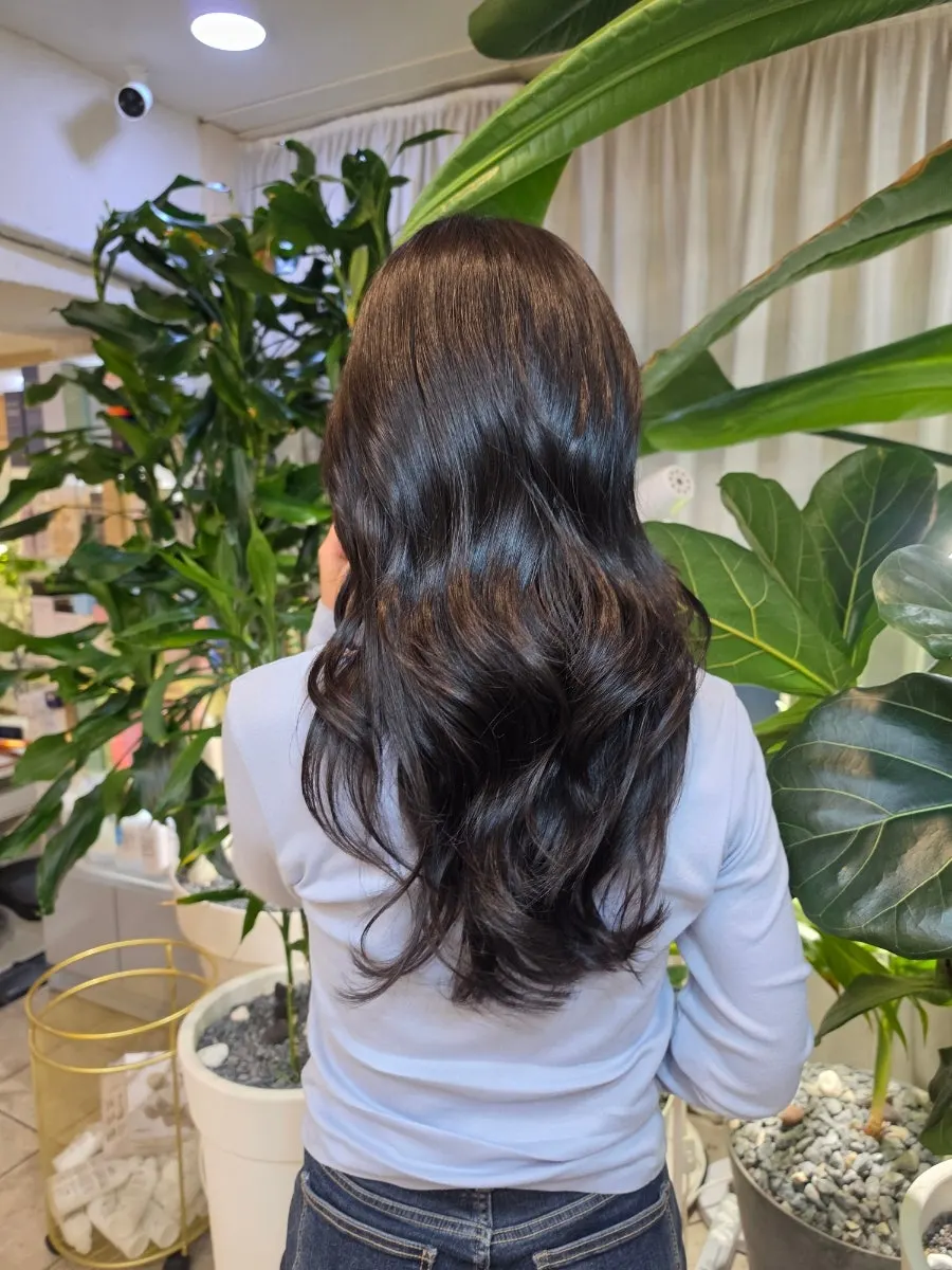 Side view of hair with neatly groomed texture after treatment