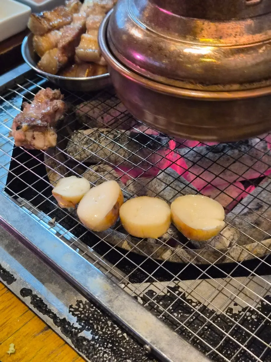 Mushrooms grilling on the tabletop grill