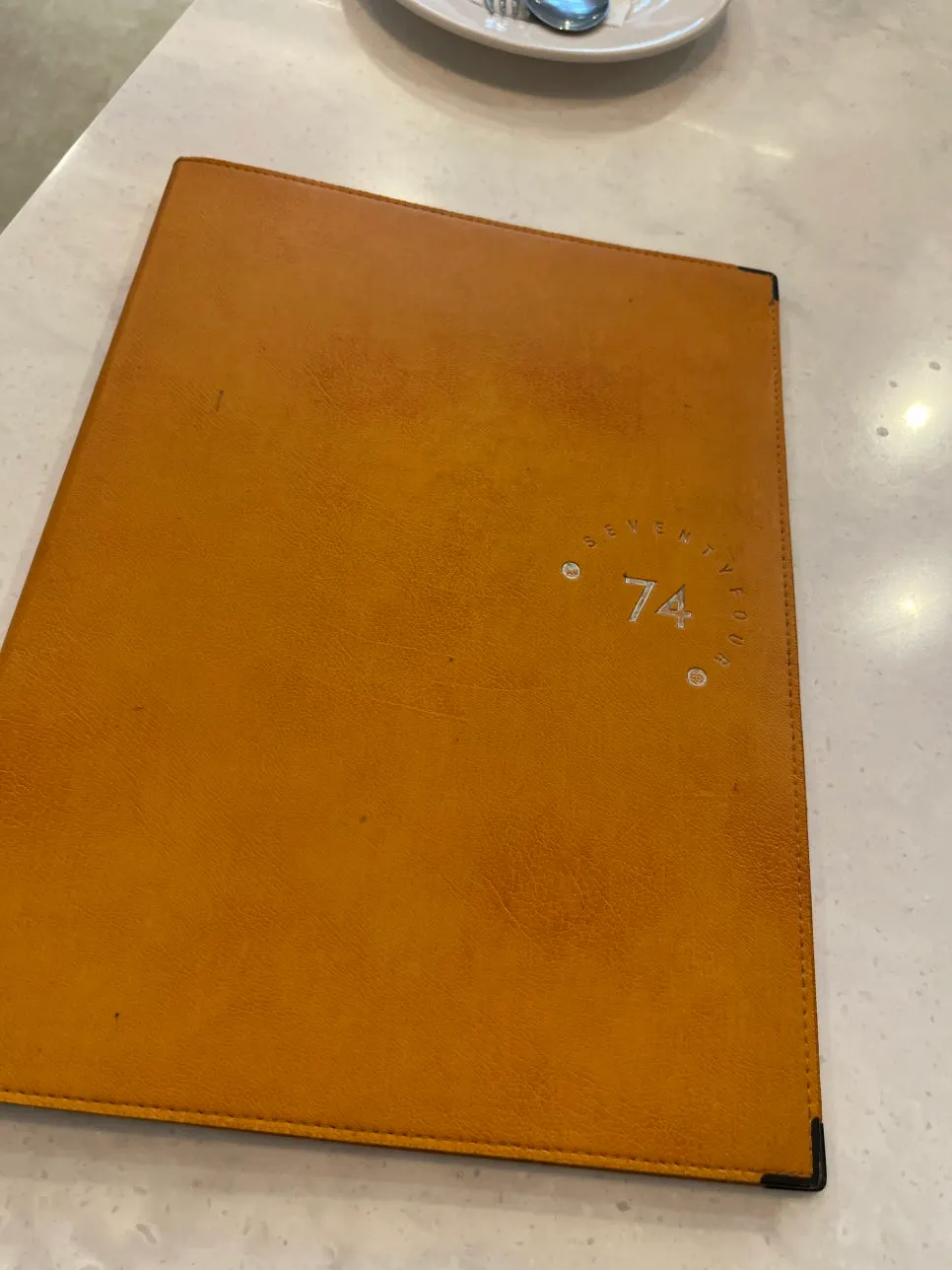 Seventy Four's leather-bound menu