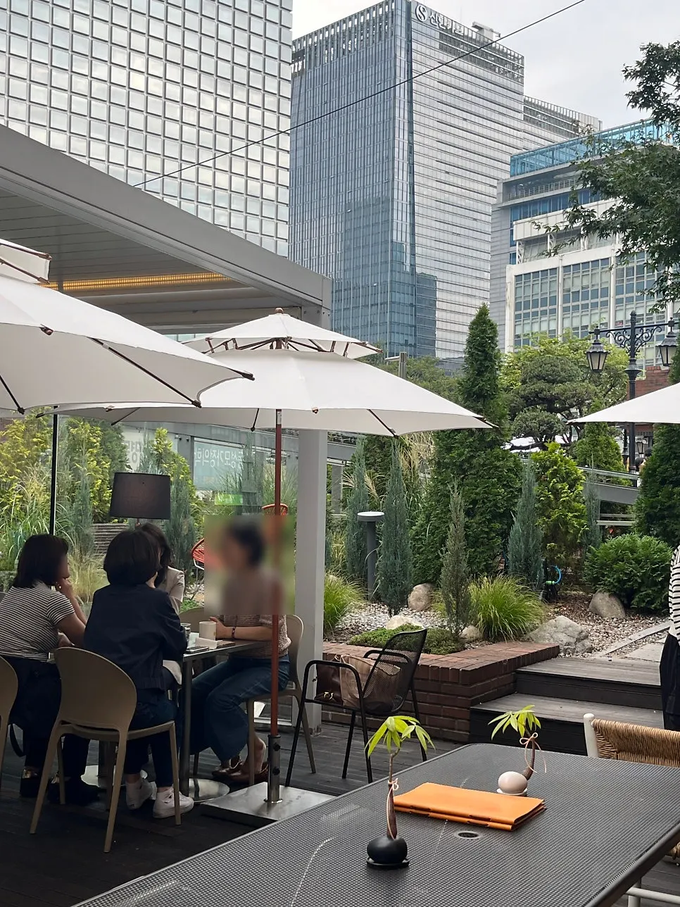 Terrace seating with parasols at Seventy Four