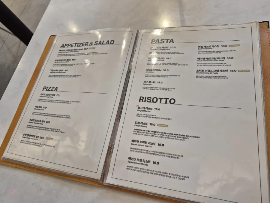 Two-person lunch spread of pasta and salad at Seventy Four